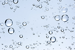 Bulles de gaz dans un liquide illustrant la fonction de synthétisation du signal bobine de l'OPTIMASS 6400